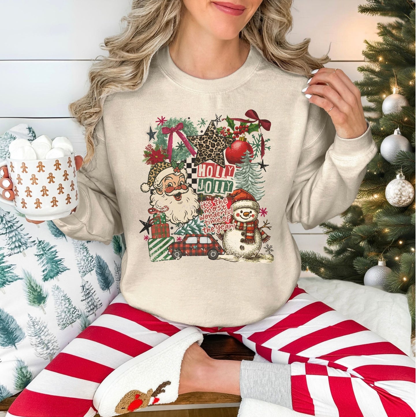 "Holly Jolly Distressed collage" on a light beige (sand) Gildan 18000 Sweatshirt.
