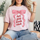 "Hot girl book club" graphic on a soft pink (blossom) t-shirt.