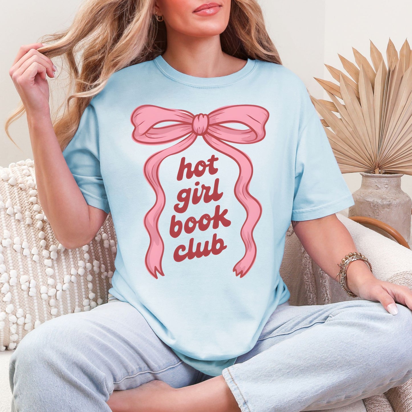 "Hot girl book club" graphic on soft medium blue (chambray) t-shirt.