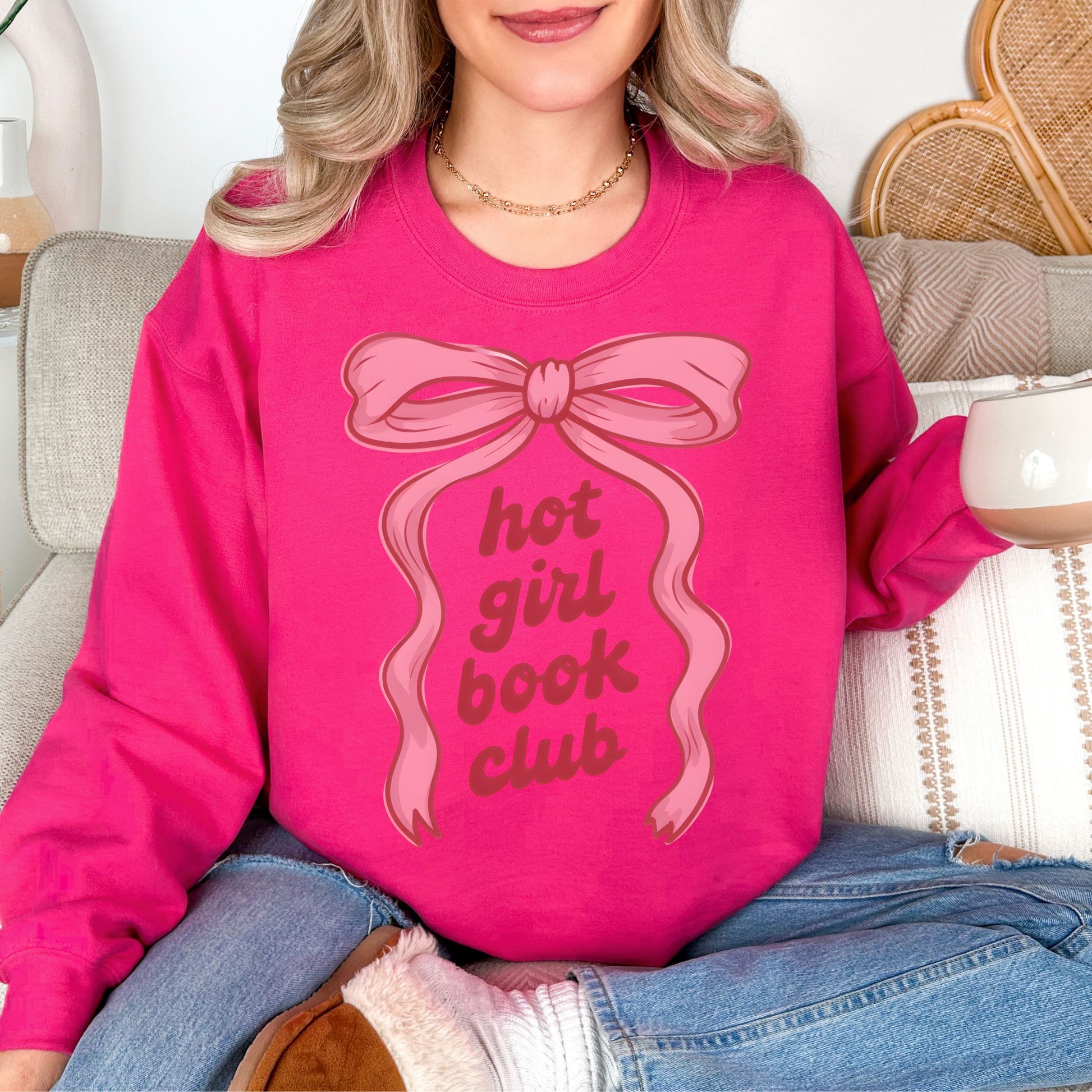"Hot girl book club" graphic on bright pink (heliconia) sweatshirt.