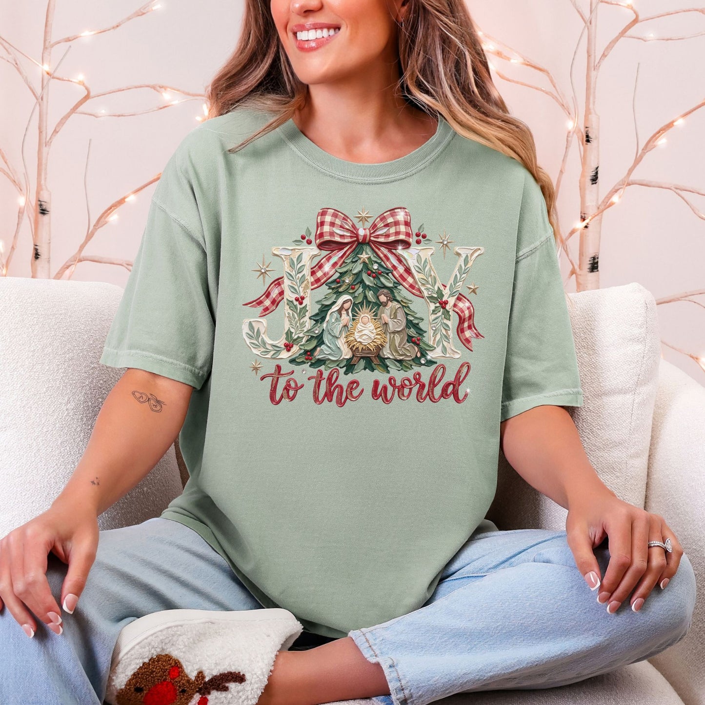 "Joy to the world" graphic on a muted teal-green (bay) Comfort Colors 1717 t-shirt.