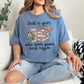 "Just a girl coffee and books" graphic on muted denim blue (blue jean) t-shirt.”