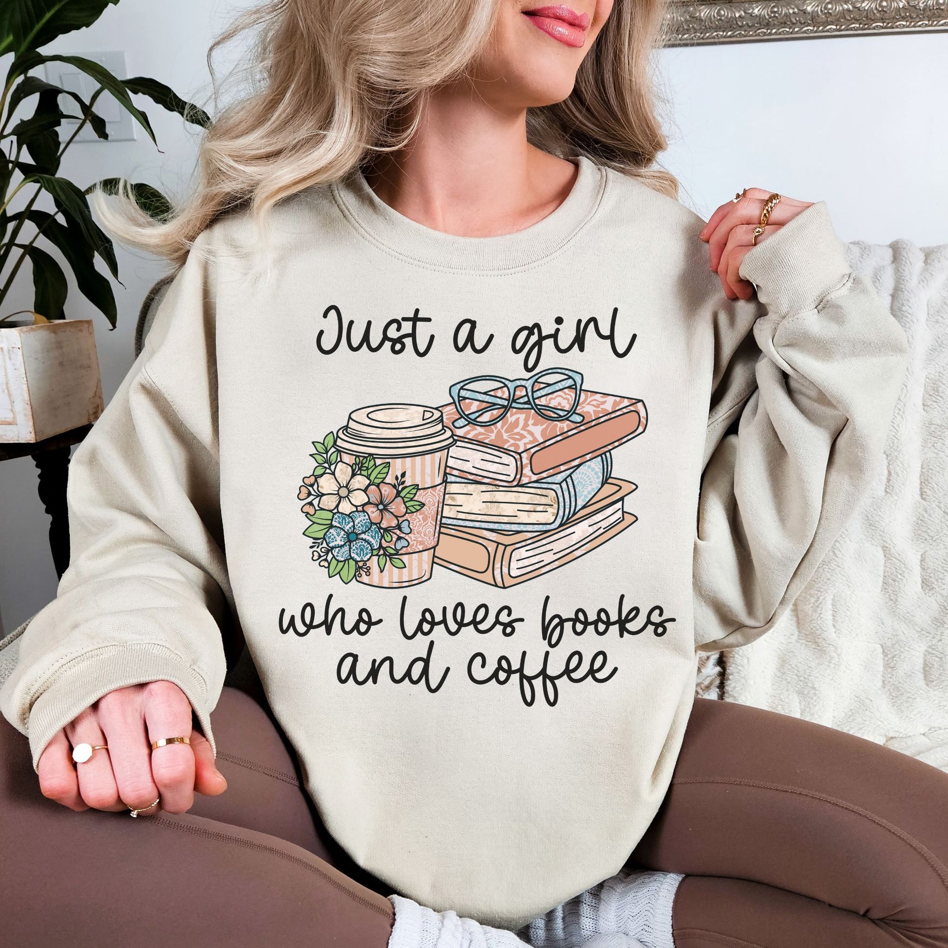 “Just a girl coffee and books" graphic on light warm beige (sand) sweatshirt.