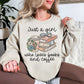 “Just a girl coffee and books" graphic on light warm beige (sand) sweatshirt.