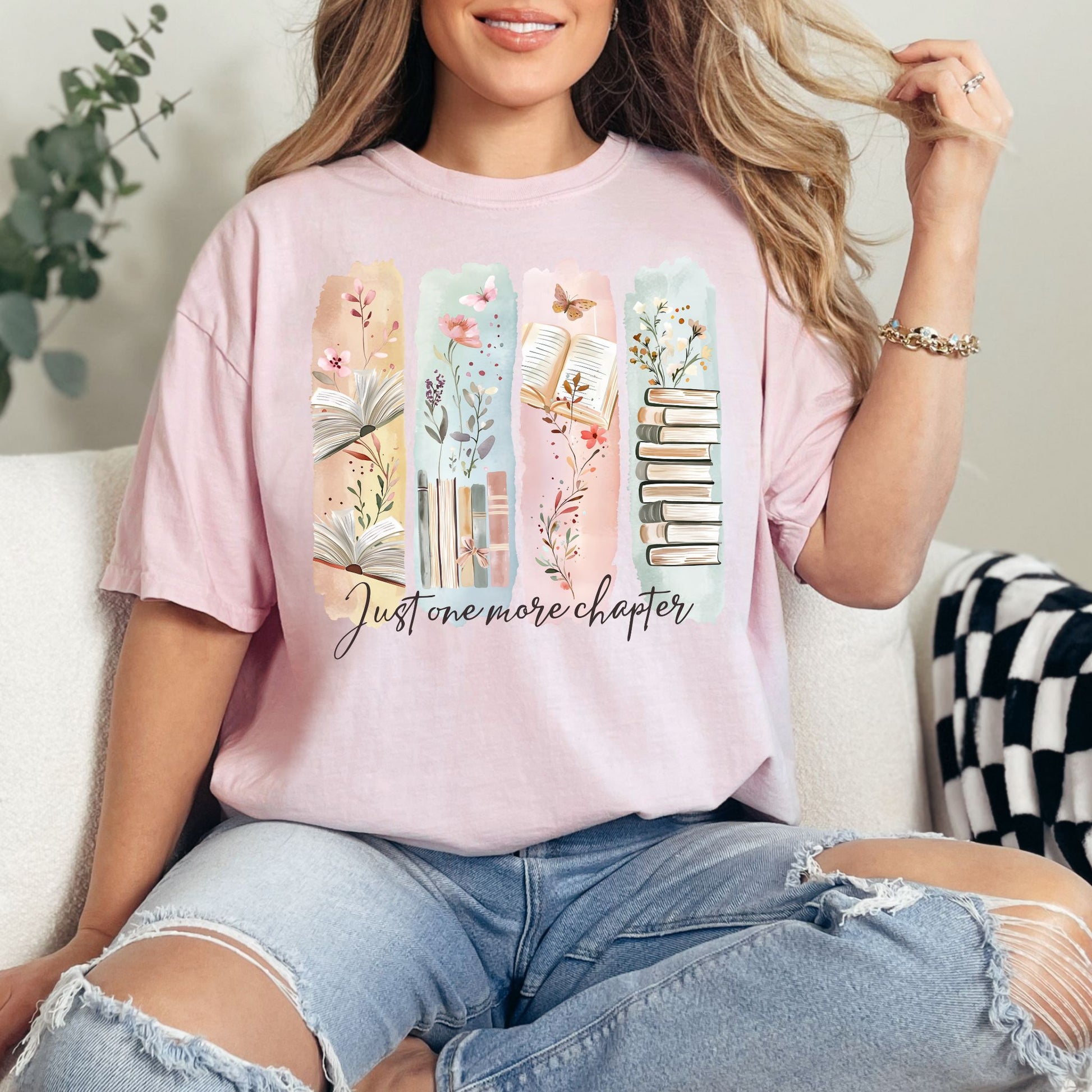 "Just One More Chapter" graphic on soft pink (blossom) t-shirt.