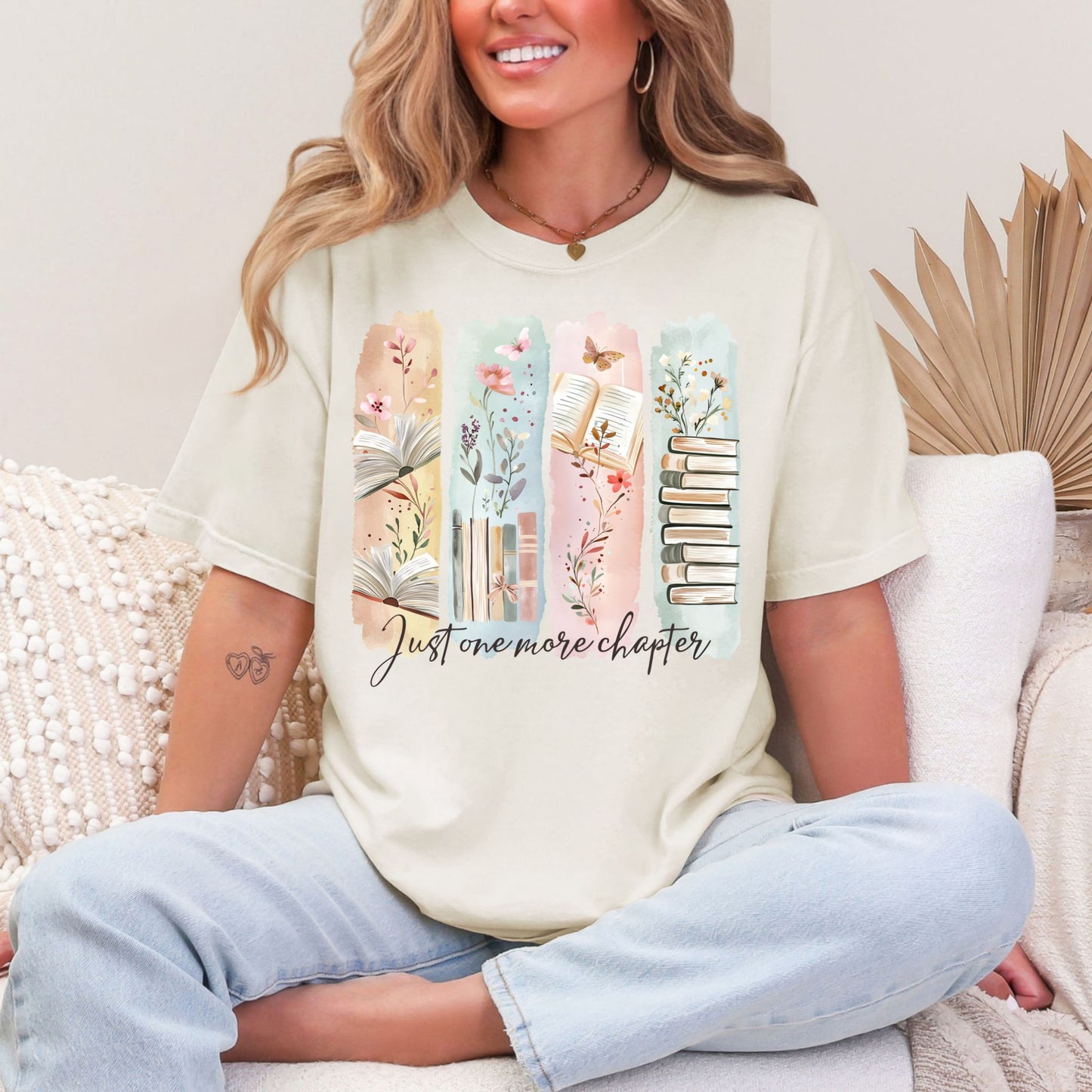 "Just One More Chapter" graphic on soft off-white (ivory) t-shirt.