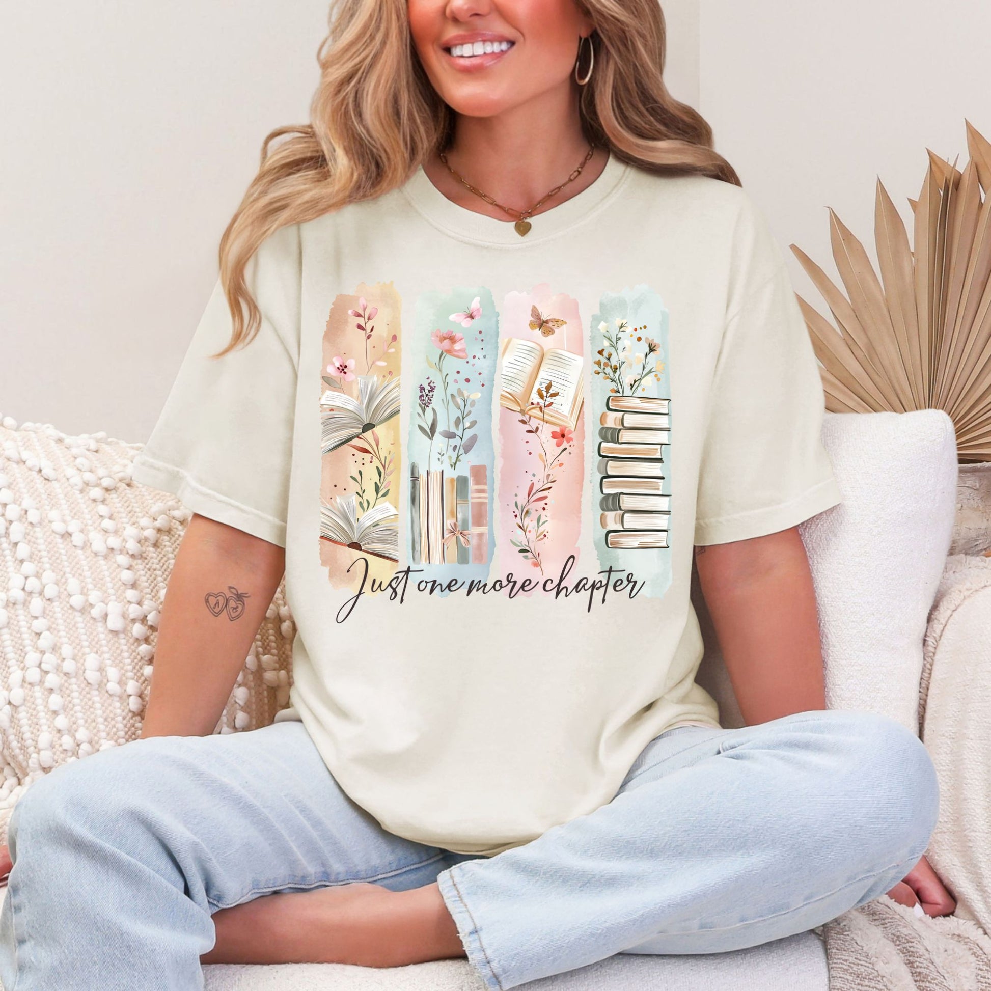 "Just One More Chapter" graphic on soft off-white (ivory) t-shirt.