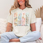 "Just One More Chapter" graphic on soft off-white (ivory) t-shirt.