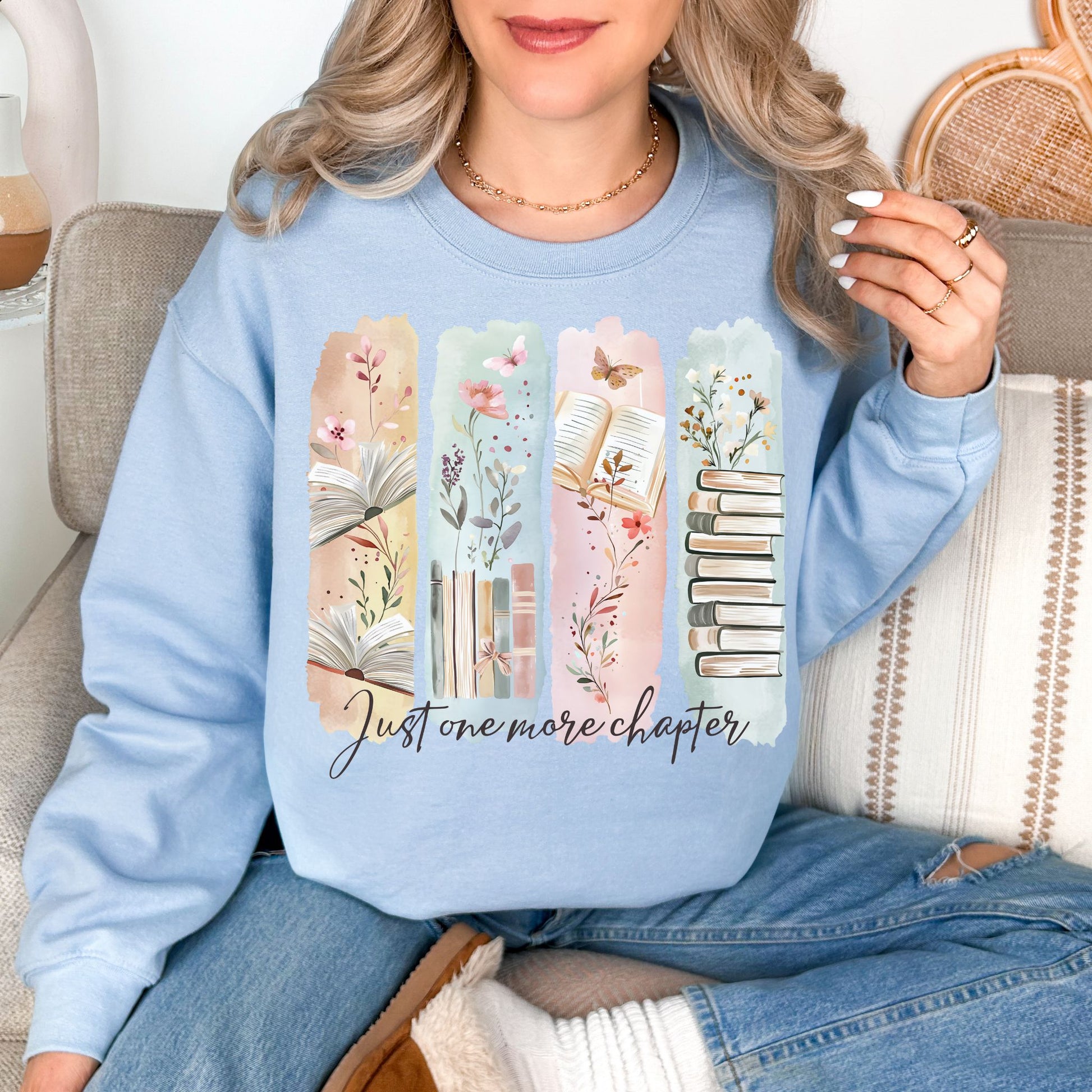 "Just One More Chapter" graphic on pale soft blue (light blue) Sweatshirt.