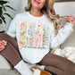 "Just One More Chapter" graphic on bright white (white) Sweatshirt.