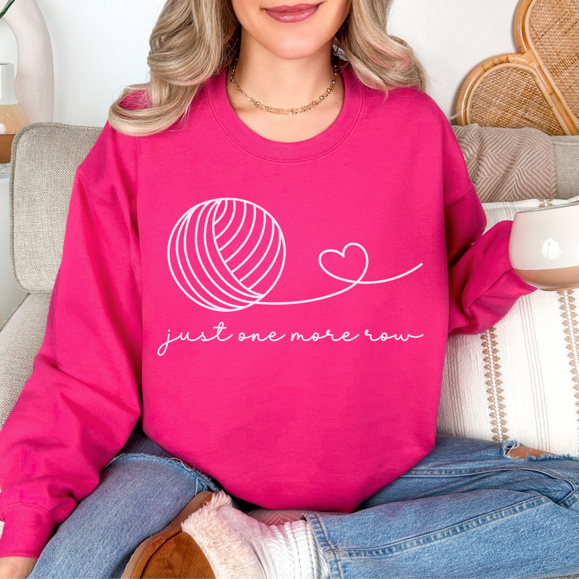 "Just One More Row" graphic on bright pink (heliconia) sweatshirt.