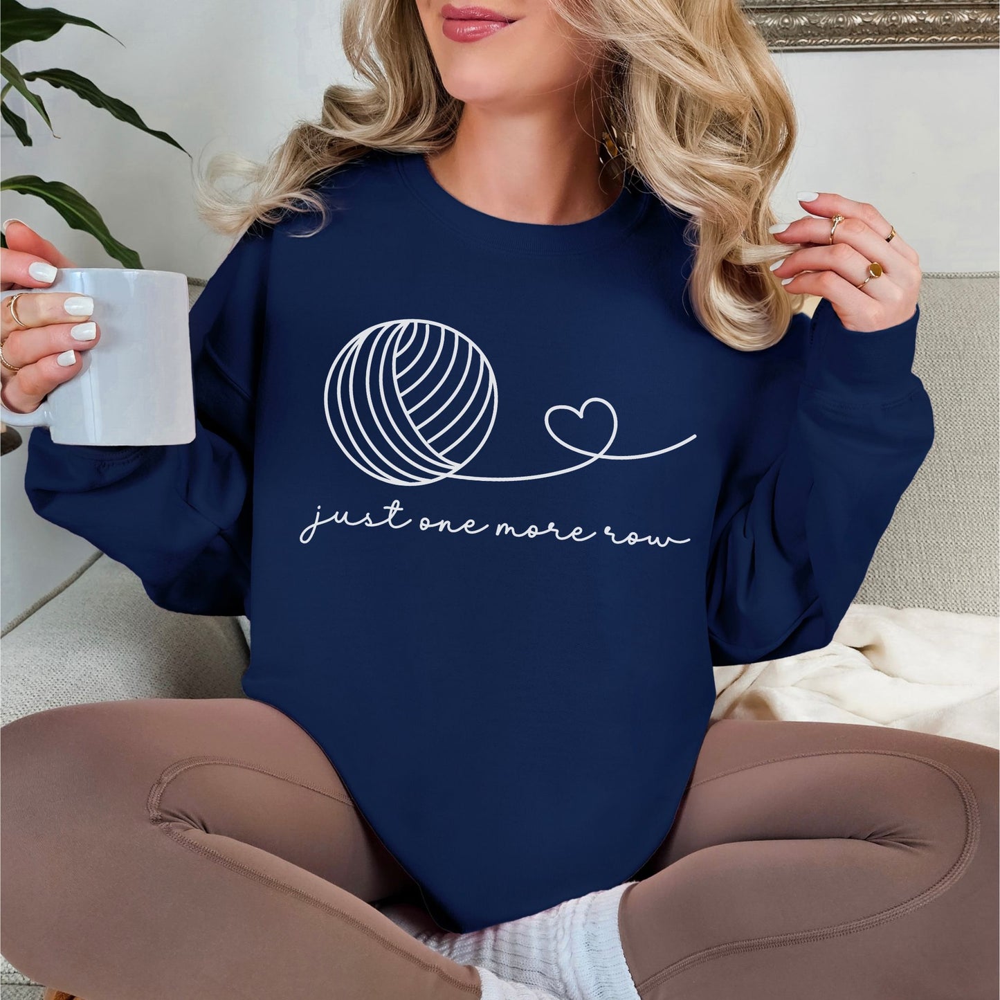 "Just One More Row" graphic on deep navy blue (navy) sweatshirt.