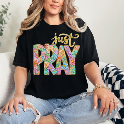 "Just Pray Floral Faux Textured" graphic on a black T-Shirt.