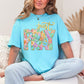 "Just Pray Floral Faux Textured" graphic on soft medium blue (lagoon blue) T-Shirt.