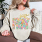 "Just Pray Floral Faux Textured" graphic on light warm beige (sand) Sweatshirt