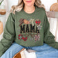 "Leopard Mama Faux Embroidery" graphic on muted olive green (military green) sweatshirt.