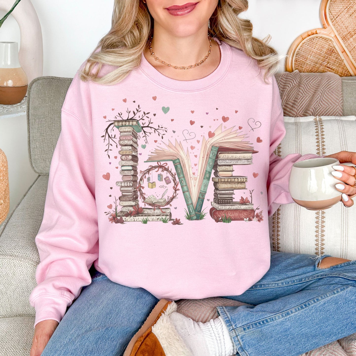 "Love Book Stack" graphic on  soft pale pink (light pink) sweatshirt