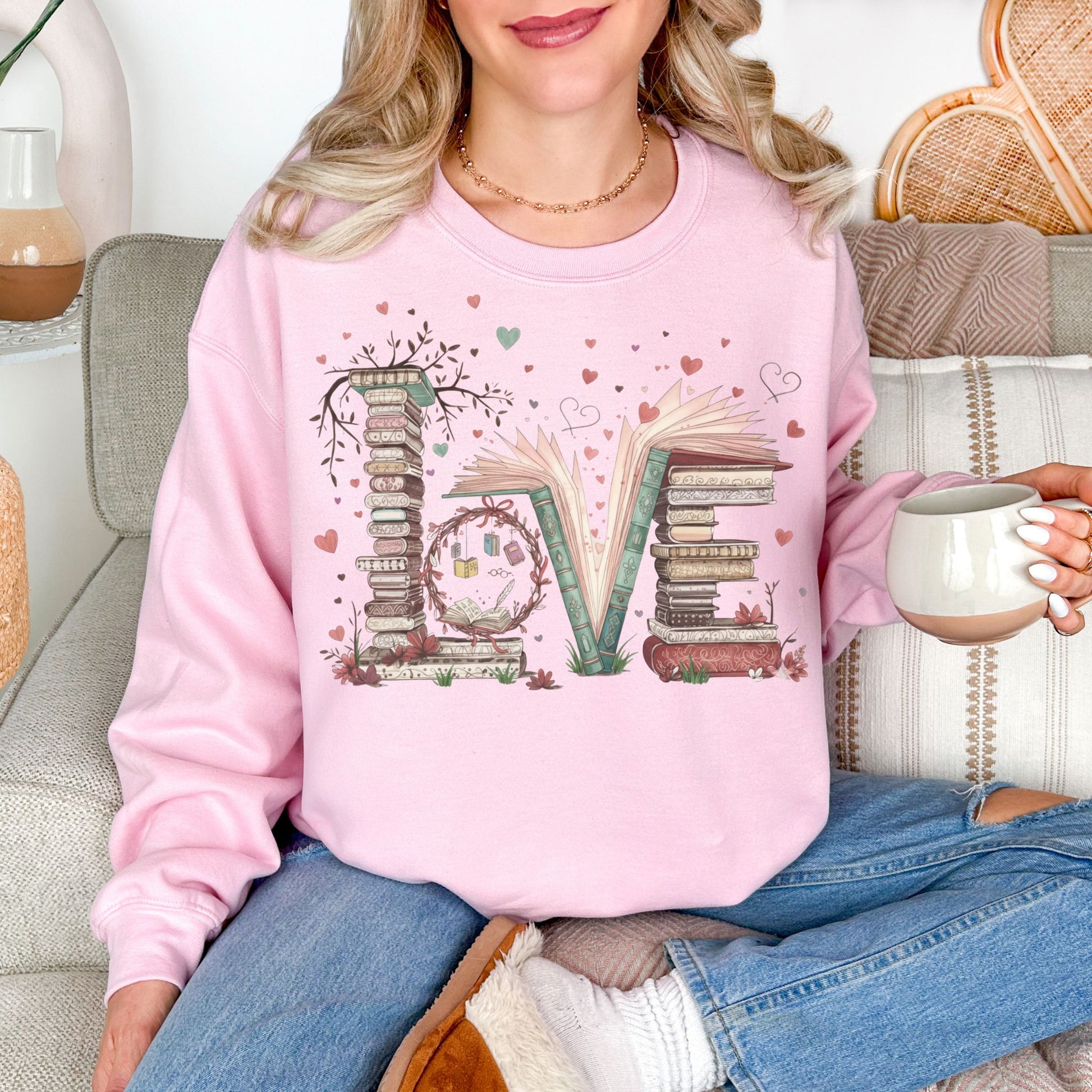 "Love Book Stack" graphic on  soft pale pink (light pink) sweatshirt