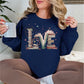 "Love Book Stack" graphic on deep navy blue (navy) sweatshirt