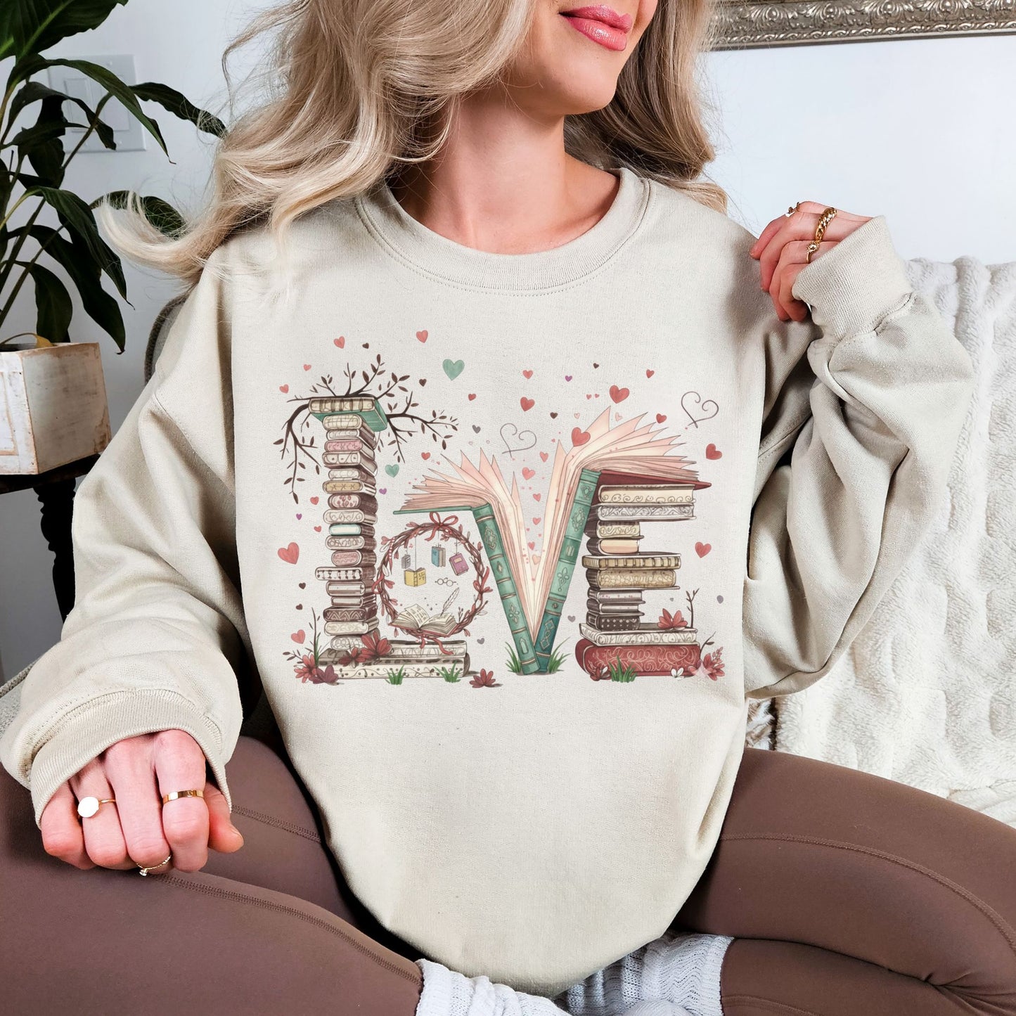 "Love Book Stack" graphic on light warm beige (sand) sweatshirt