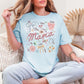"Mama Coquette Doodle" graphic on soft medium blue (chambray) t-shirt.