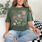 "Mama Coquette Doodle" graphic on muted earthy green-gray (hemp) t-shirt.