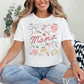"Mama Coquette Doodle" graphic on a white t-shirt.