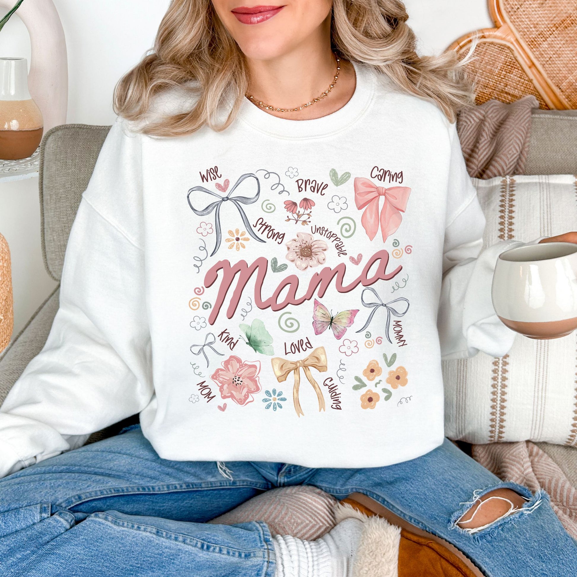 "Mama Coquette Doodle" graphic on a white sweatshirt.