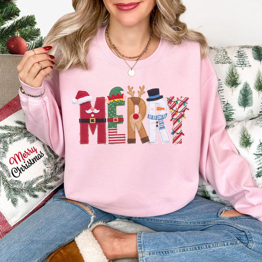 "Merry Christmas Faux Felt Appliqué" graphic on soft pale pink (light pink) Gildan 18000 sweatshirt.