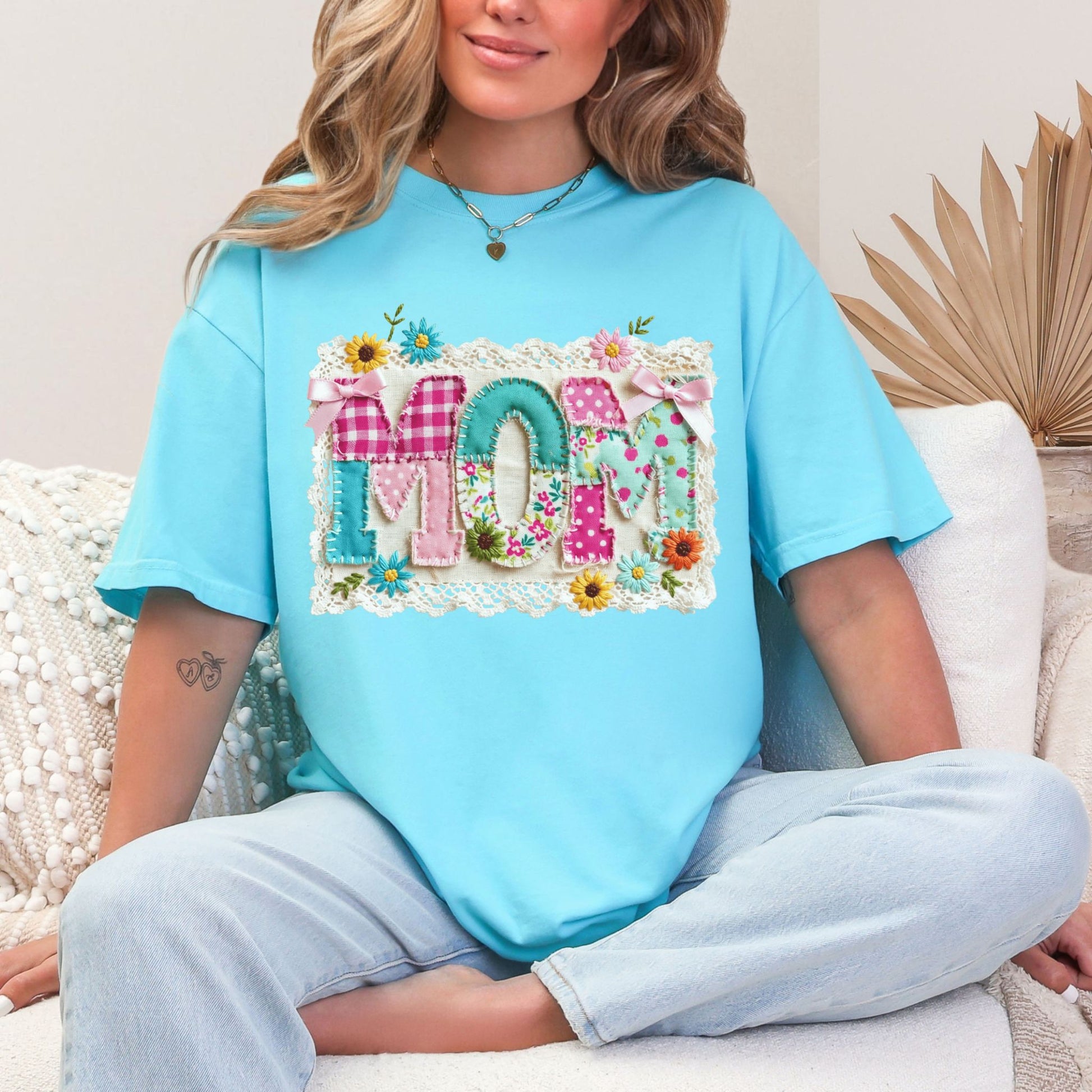 "Mom Patchwork" graphic on color soft medium blue (lagoon blue) T-Shirt.