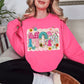 “Mom Patchwork" graphic on bright neon pink (safety pink) sweatshirt.