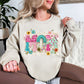 “Mom Patchwork" graphic on light beige (sand) sweatshirt.