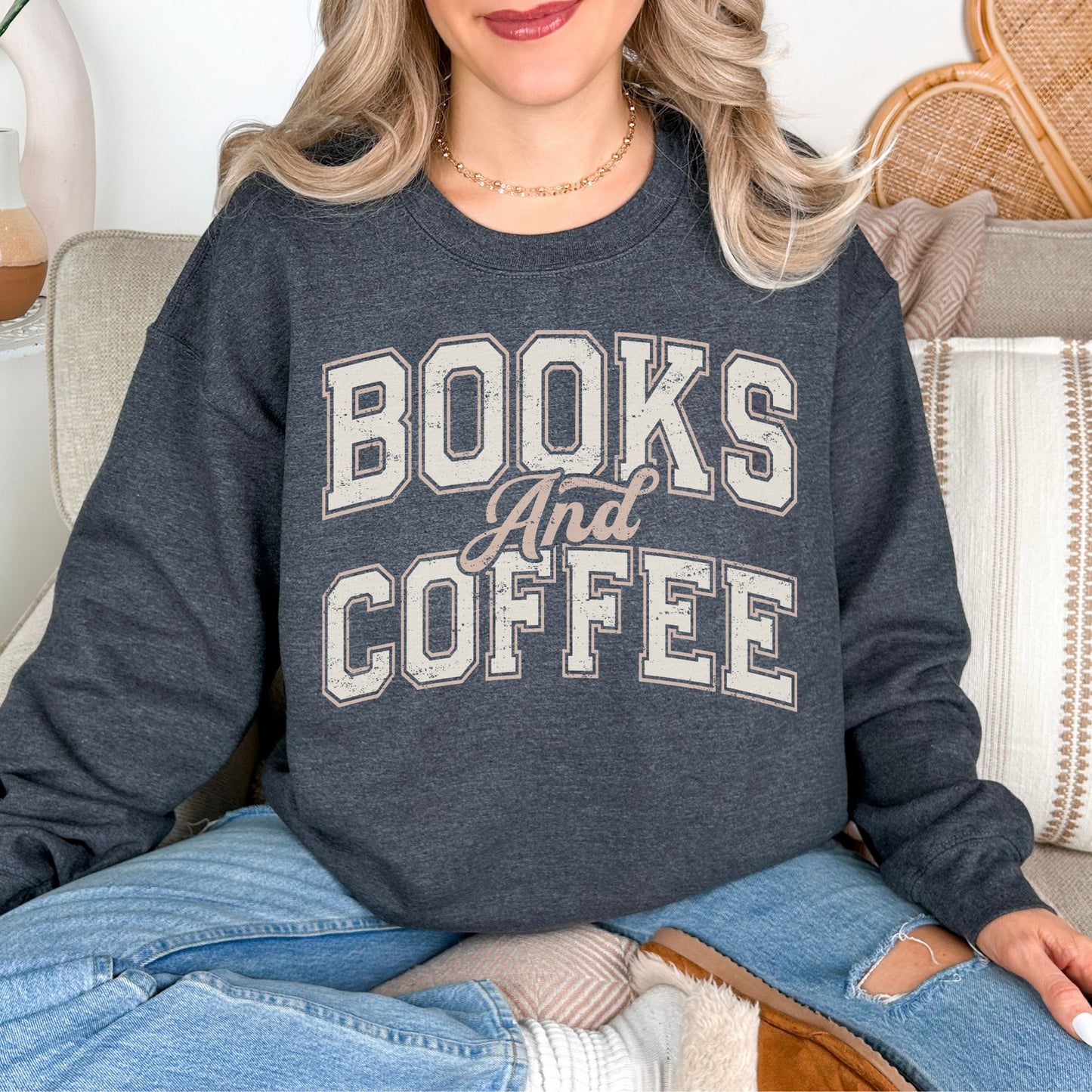 “Neutral Books and Coffee" graphic on deep heather gray (dark heather) Gildan 18000 Sweatshirt.