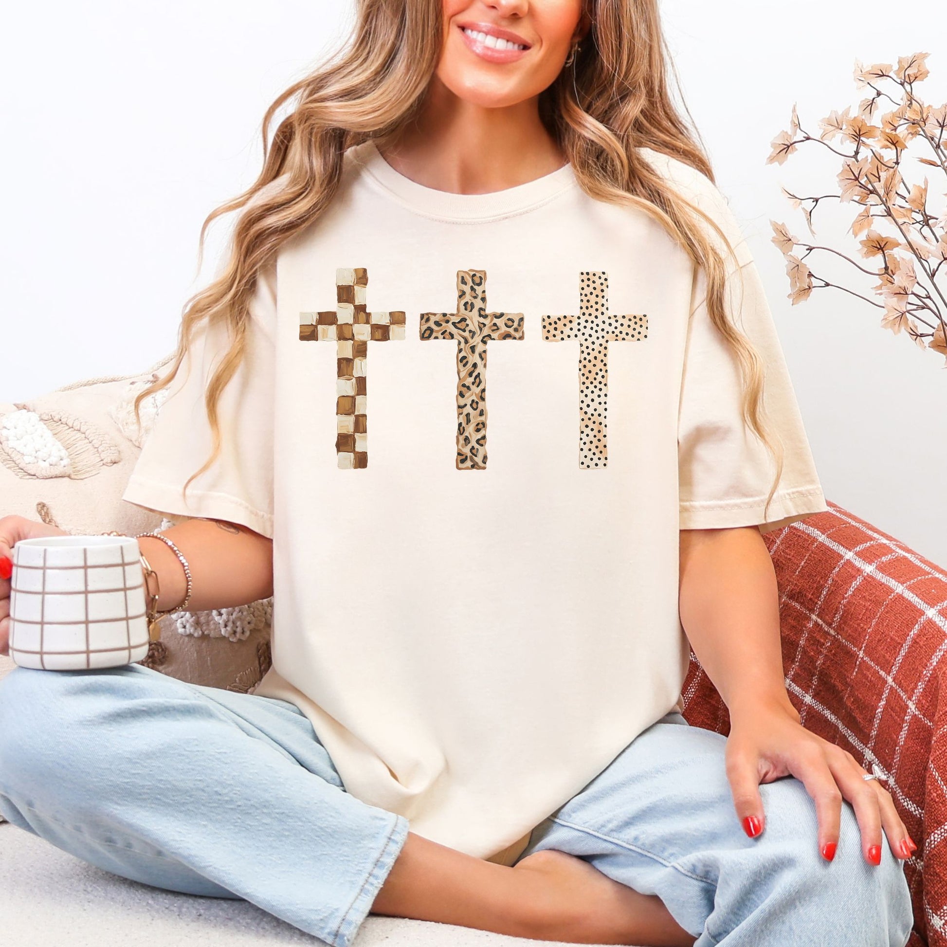 "Neutral Faux Painted Crosses Christian" graphic in soft off-white (ivory) Comfort Colors T-Shirt.