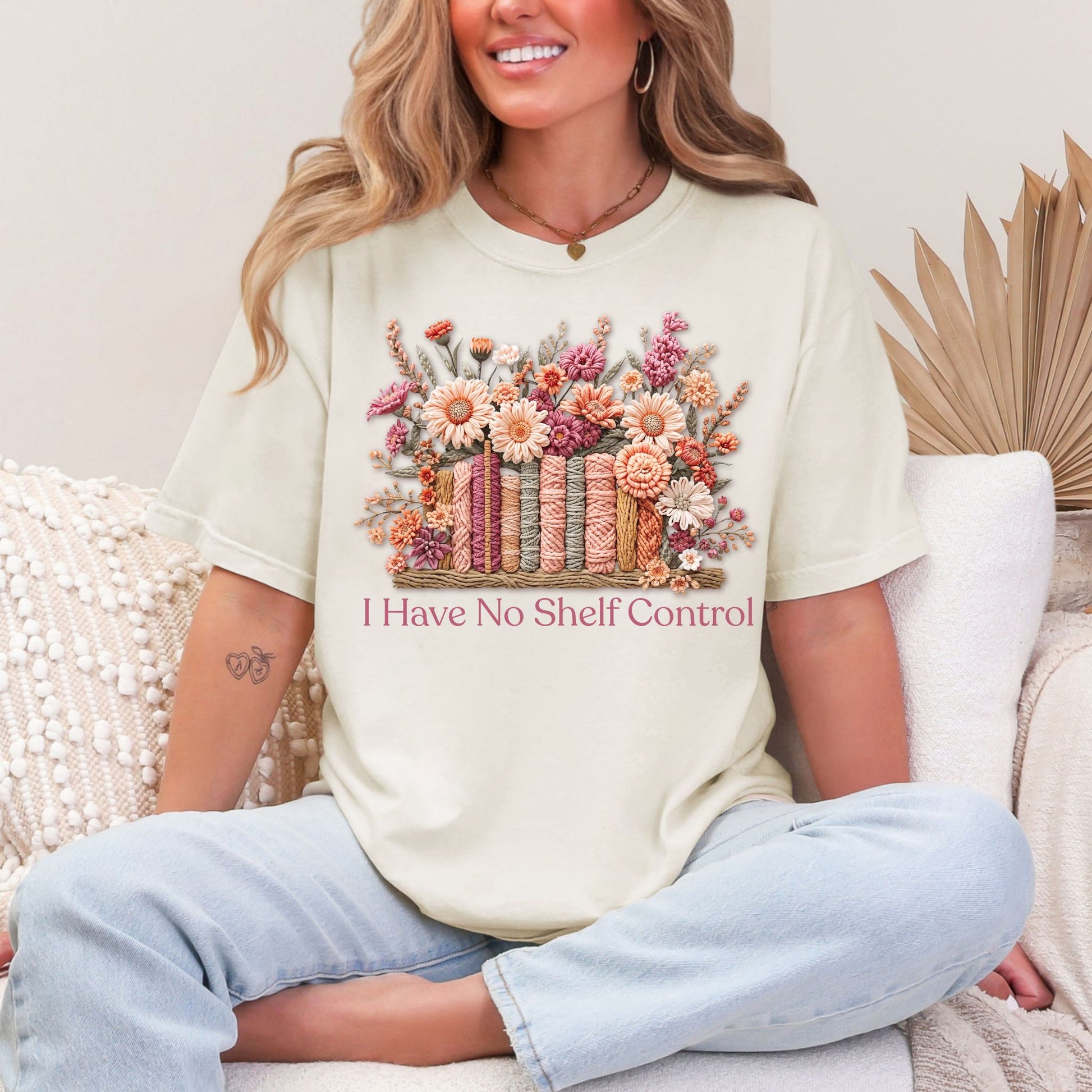 "No Shelf Control" graphic on soft off-white (ivory) t-shirt.