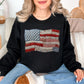"Faux Patchwork American Flag" graphic on a black sweatshirt.
