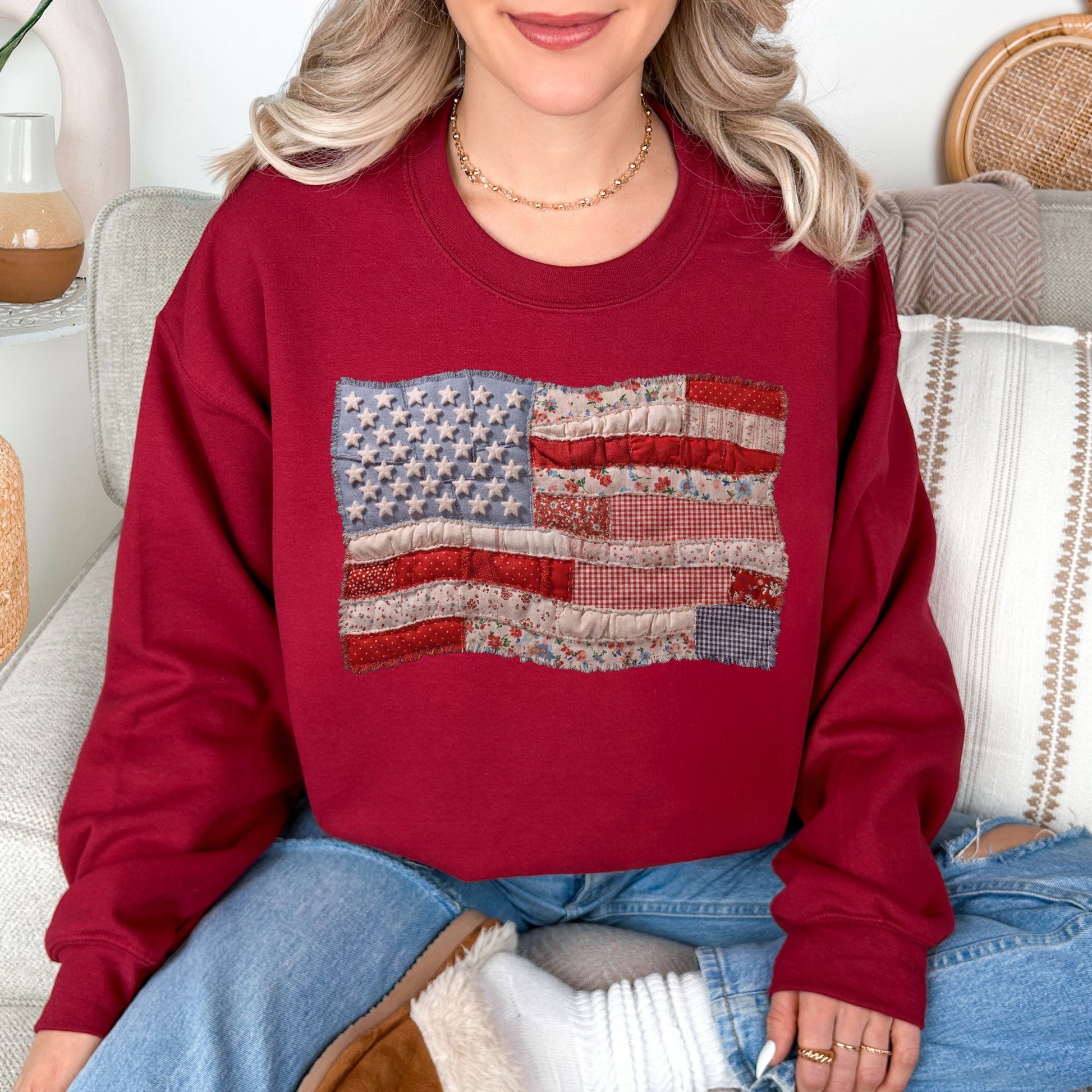 "Faux Patchwork American Flag" graphic on dark red (cardinal red) sweatshirt.