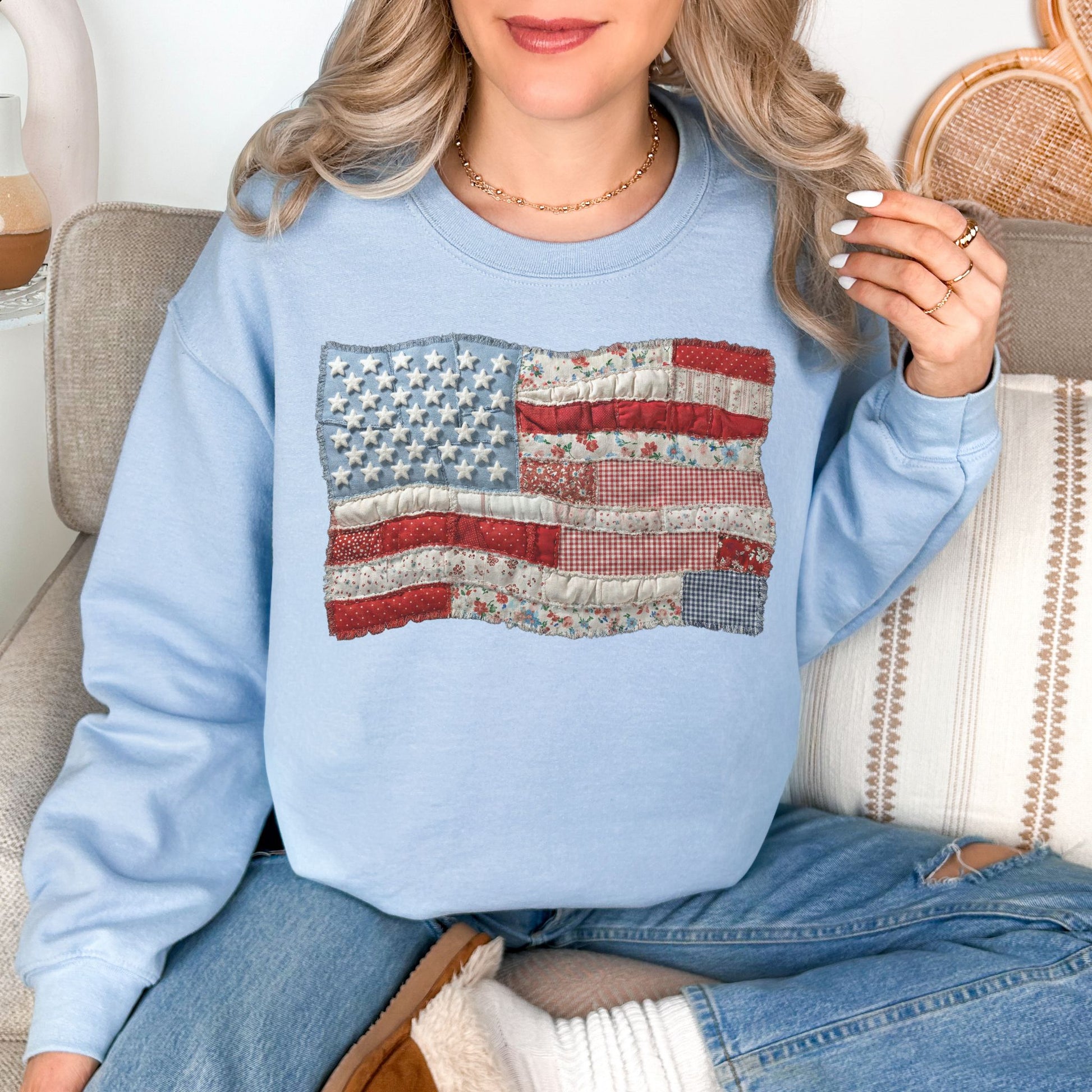 "Faux Patchwork American Flag" graphic on pale blue (light blue) sweatshirt.