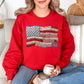 Model is wearing a Gildan 18000 T-Shirt in true red (red) featuring a faux patchwork American flag design with stars, stripes, gingham, floral prints, and fabric-style textures.
