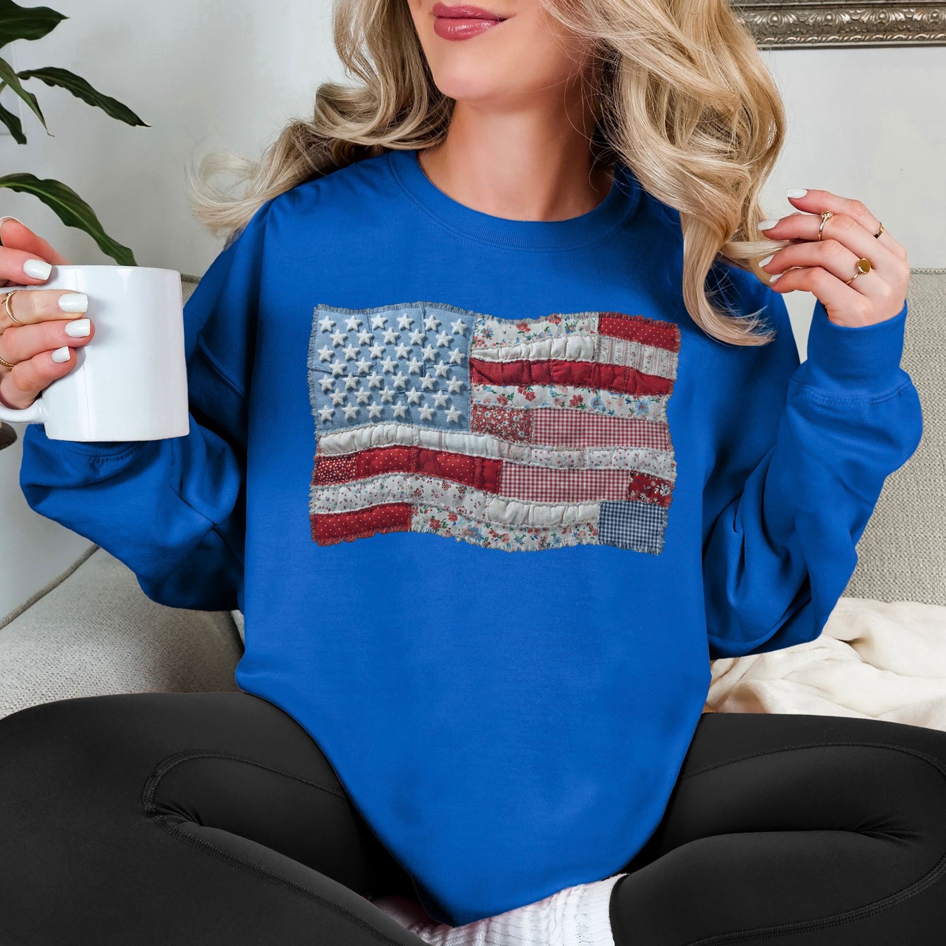 "Faux Patchwork American Flag" graphic on bright medium blue (royal blue) sweatshirt.