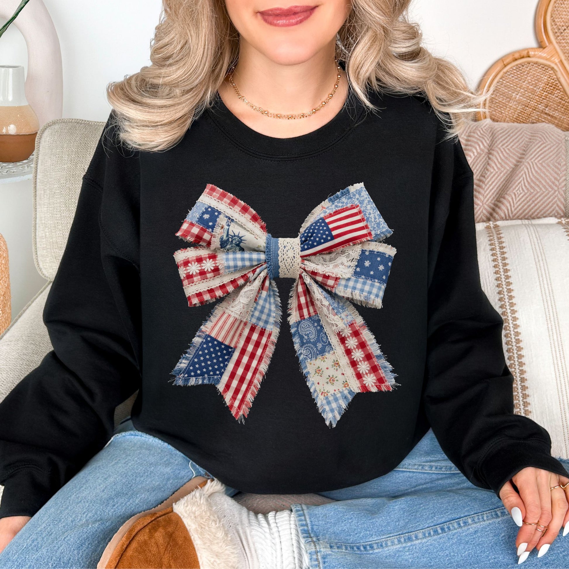 “Patriotic Patchwork Faux Bow" graphic on a black sweatshirt.