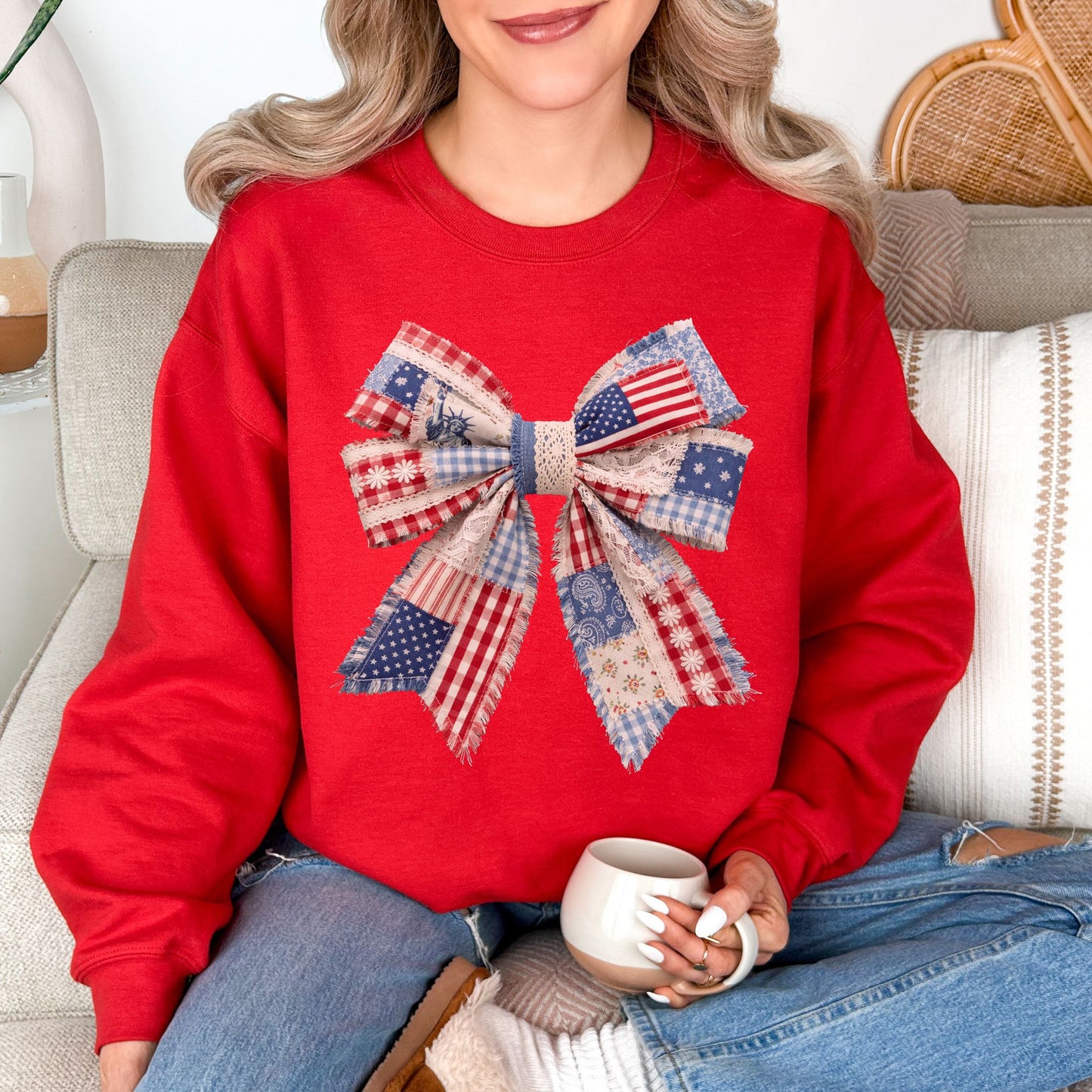 “Patriotic Patchwork Faux Bow" graphic on true red (red) sweatshirt.