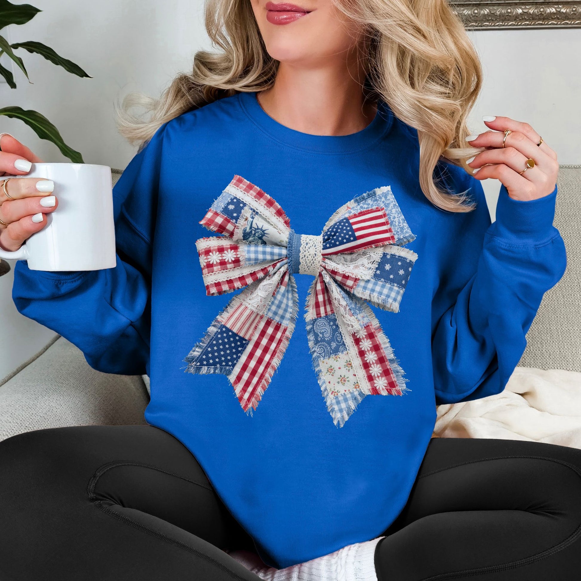 “Patriotic Patchwork Faux Bow" graphic on bright medium blue (royal blue) sweatshirt.