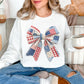“Patriotic Patchwork Faux Bow" graphic on very white (white) sweatshirt.