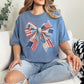 “Patriotic Patchwork Faux Bow" graphic on muted denim blue (blue jean) t-shirt.