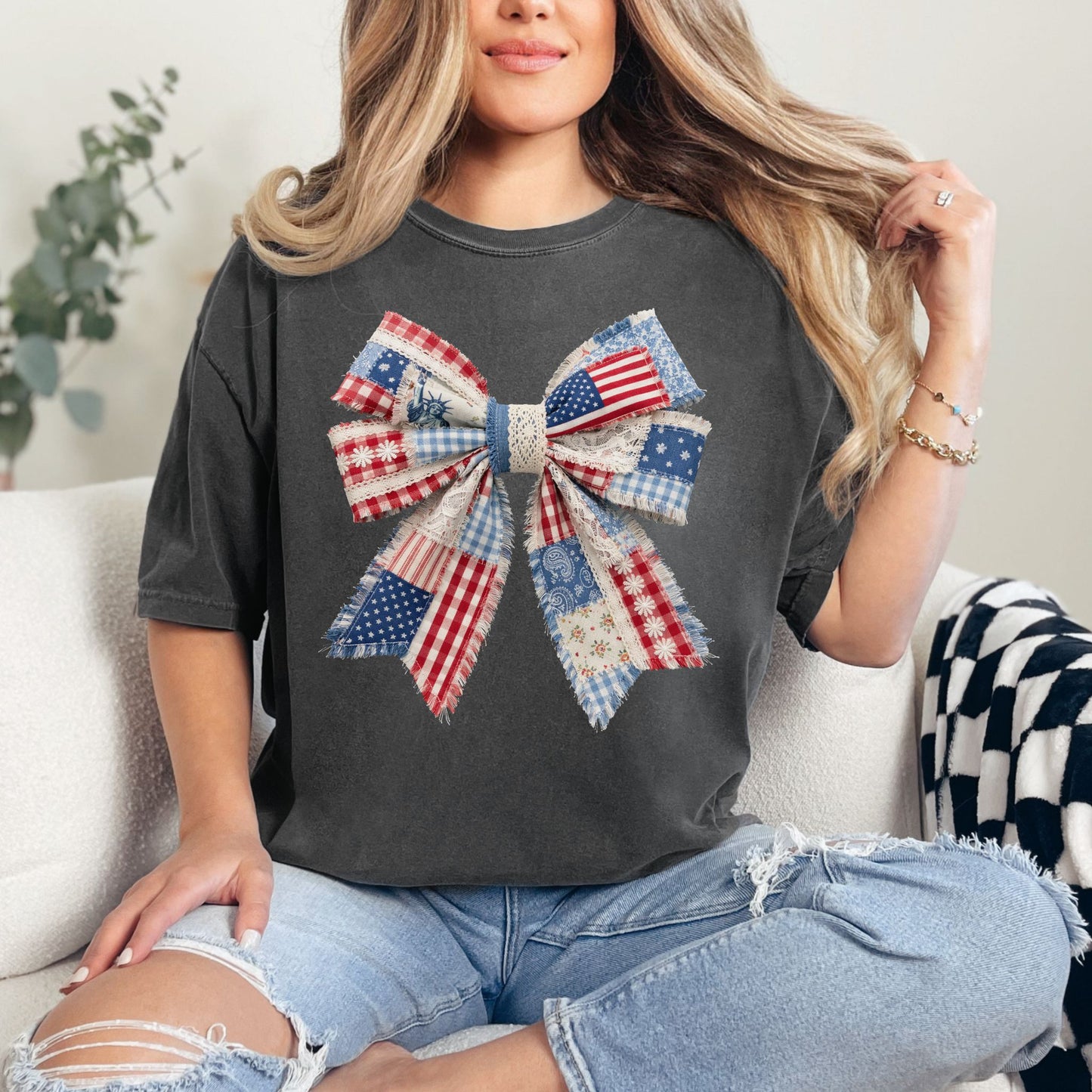 “Patriotic Patchwork Faux Bow" graphic on dark charcoal gray (pepper) t-shirt.