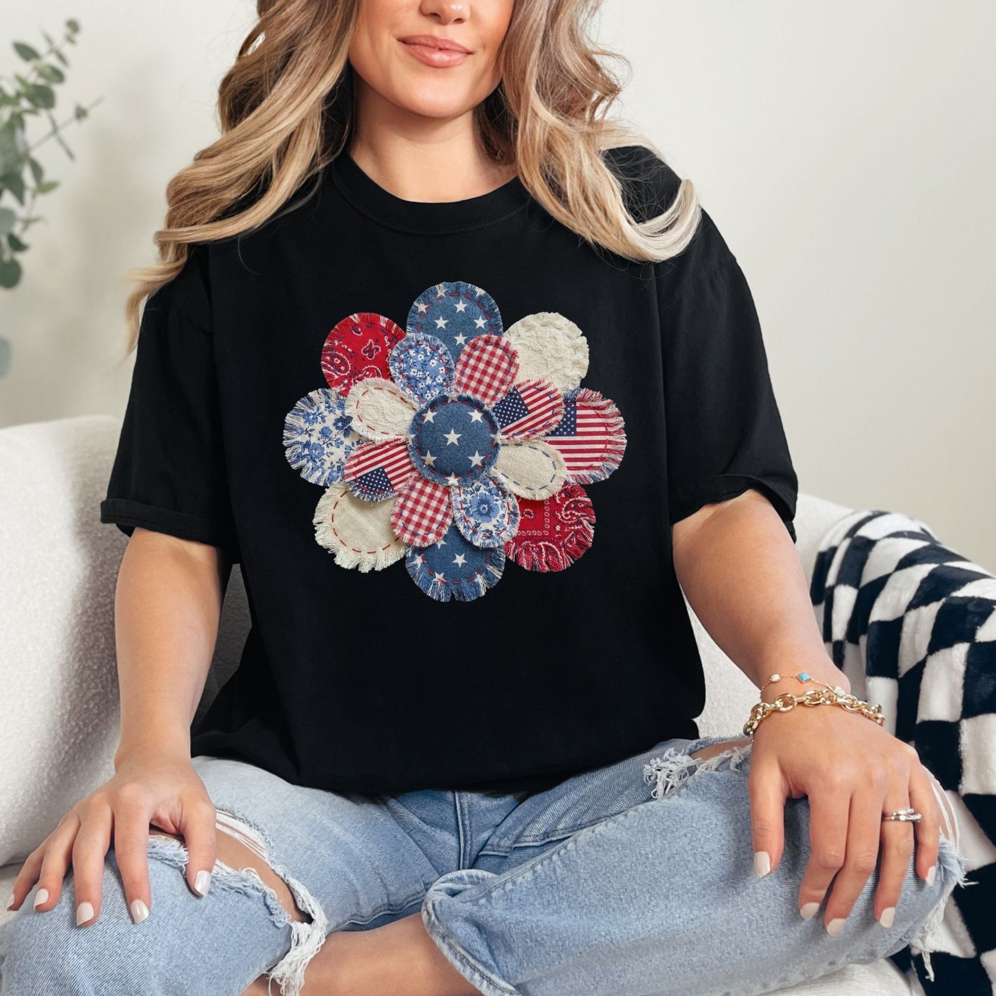 "Patriotic Patchwork Flower" graphic on a black T-Shirt.
