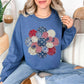 "Patriotic Patchwork Flower" graphic on deep muted blue (indigo blue) sweatshirt.