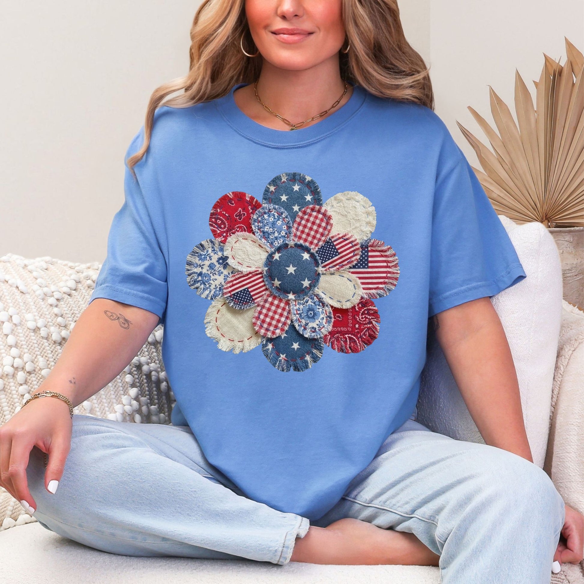 "Patriotic Patchwork Flower" graphic on a muted blue-green (mystic blue) T-Shirt.