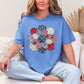 "Patriotic Patchwork Flower" graphic on a muted blue-green (mystic blue) T-Shirt.